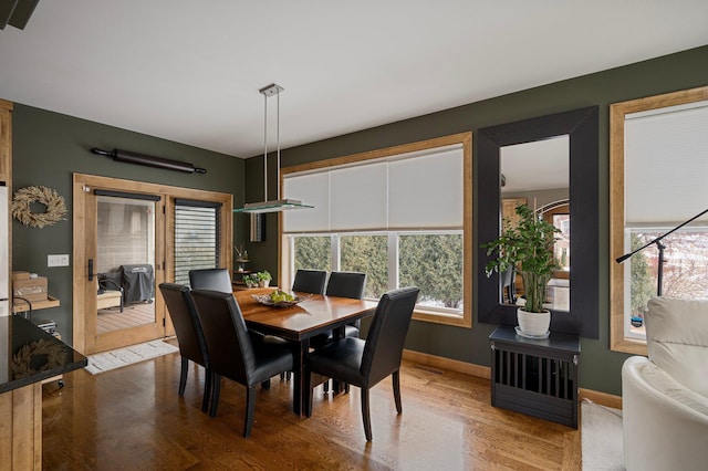 dining space featuring hardwood / wood-style floors