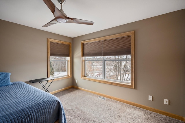 carpeted bedroom featuring ceiling fan