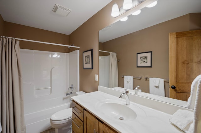 full bathroom featuring vanity, toilet, and shower / tub combo