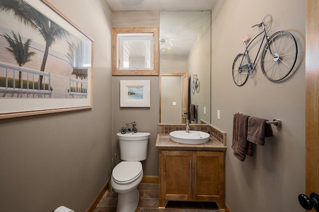 bathroom with vanity, tile patterned floors, and toilet