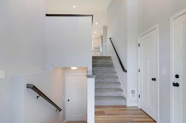 stairs with wood-type flooring