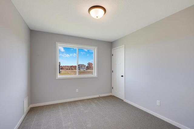 empty room featuring carpet flooring