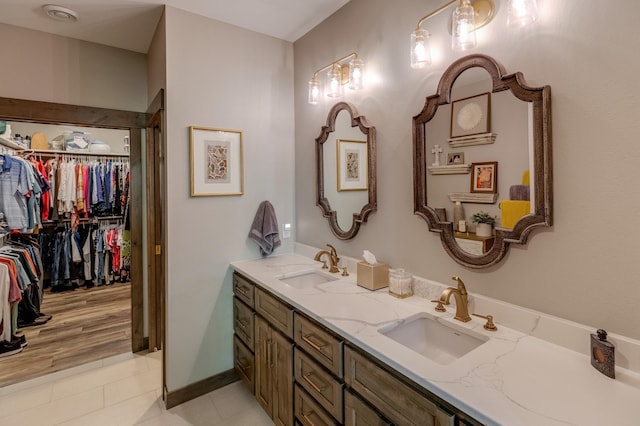 bathroom featuring tile patterned flooring and vanity