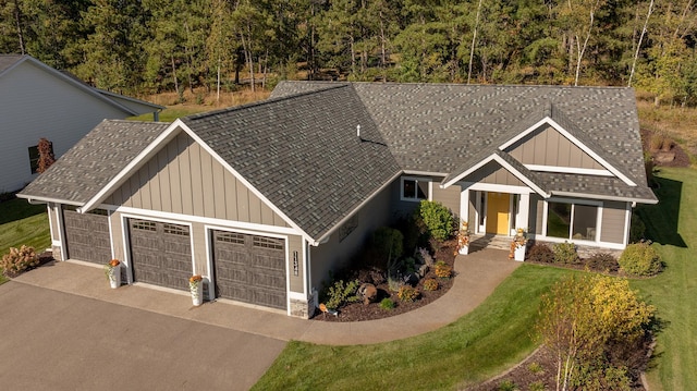 view of front of property featuring a garage and a front lawn