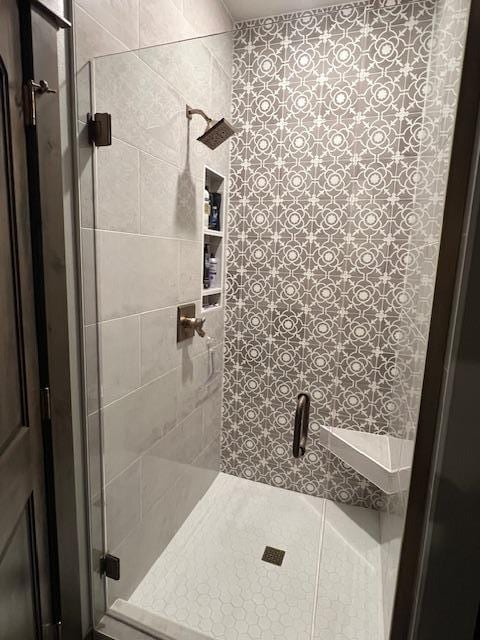 bathroom featuring an enclosed shower