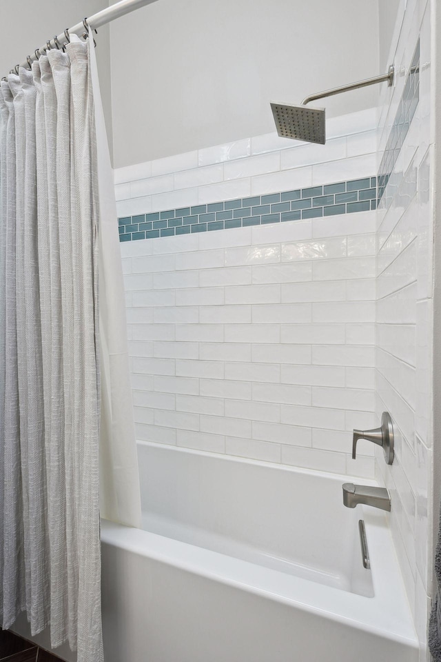 bathroom with shower / tub combo with curtain