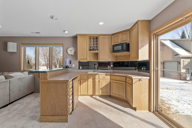 kitchen featuring light tile patterned flooring and light brown cabinets