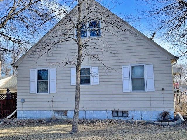 view of property exterior with fence