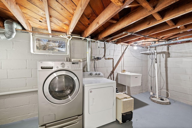 laundry area with sink and washer and clothes dryer