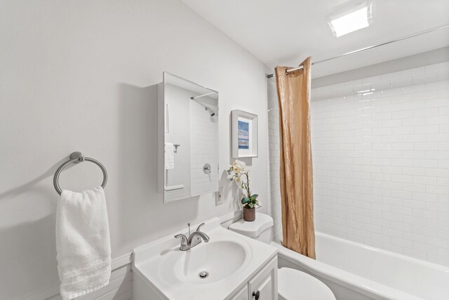 full bathroom with vanity, toilet, and shower / bath combo