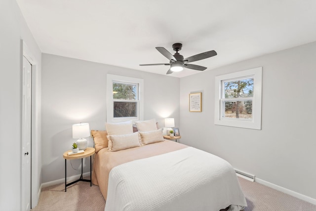 bedroom featuring light colored carpet and ceiling fan