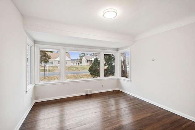 empty room featuring dark hardwood / wood-style floors