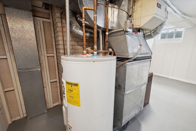 utility room featuring water heater