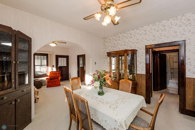 dining area with ceiling fan and carpet floors