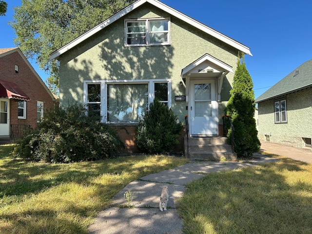 view of front of home with a front lawn