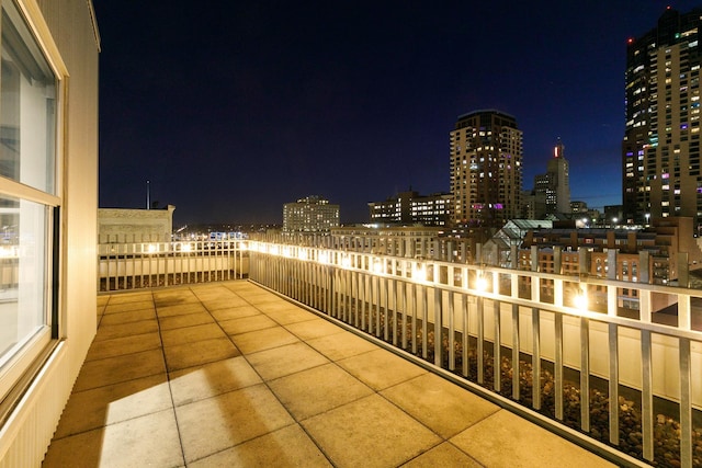 view of balcony at twilight