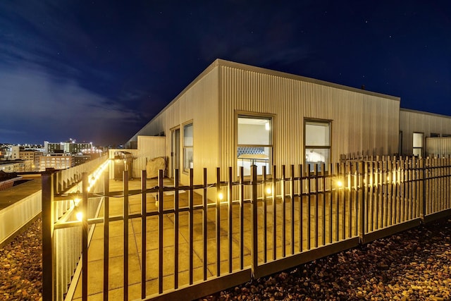 view of property exterior at night