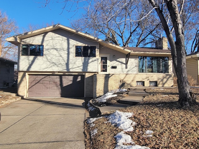 rear view of house featuring a garage