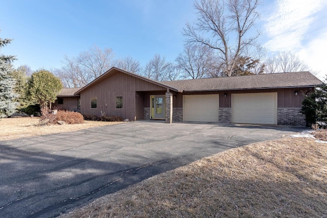 ranch-style house featuring a garage