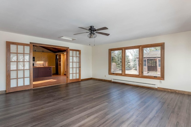 unfurnished living room featuring baseboard heating, dark hardwood / wood-style flooring, and french doors