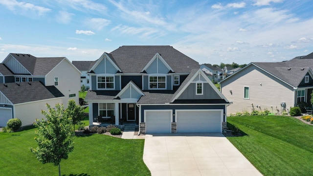 craftsman inspired home with a garage and a front lawn