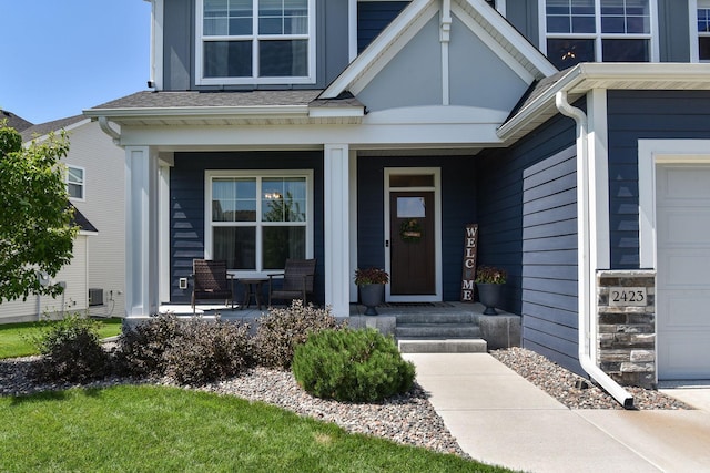 entrance to property featuring covered porch