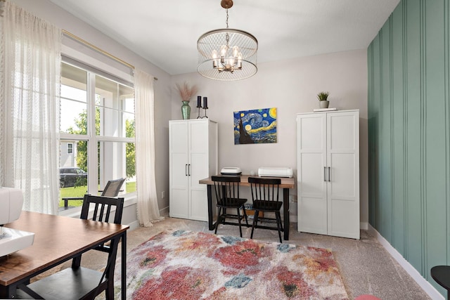 dining area with an inviting chandelier