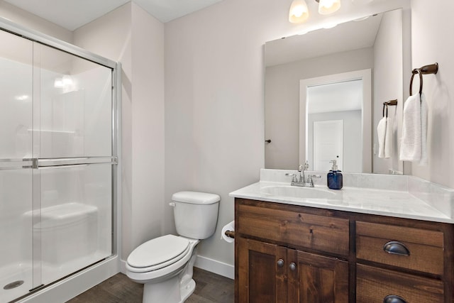 bathroom with walk in shower, wood-type flooring, toilet, and vanity