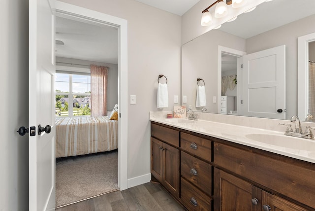 bathroom featuring vanity and hardwood / wood-style floors