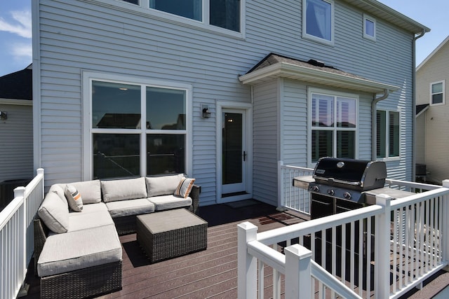 wooden terrace with grilling area and an outdoor hangout area