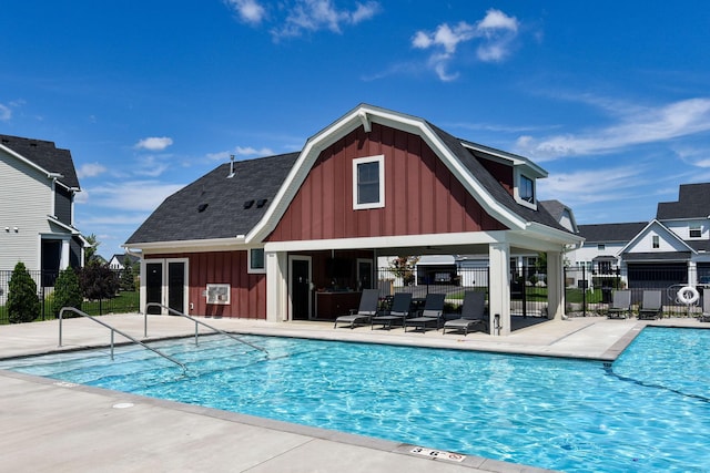 view of swimming pool with a patio