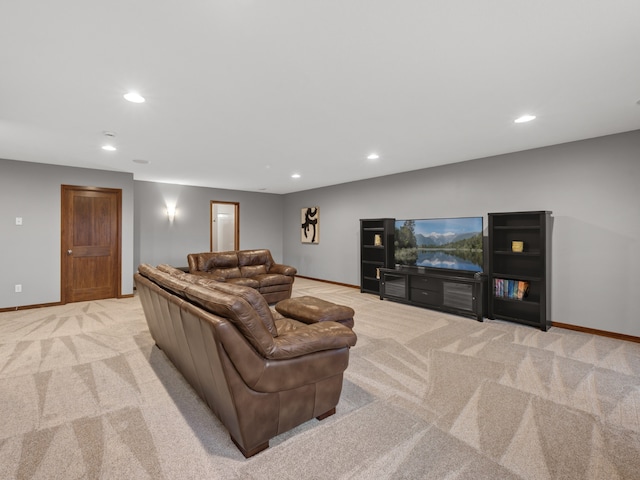 living room featuring light carpet, baseboards, and recessed lighting