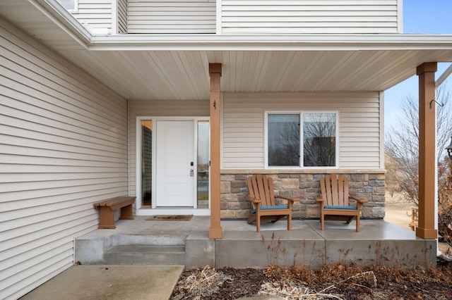 view of exterior entry featuring stone siding