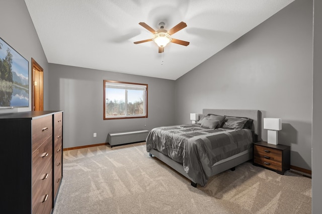 bedroom featuring lofted ceiling, light carpet, a ceiling fan, and baseboards