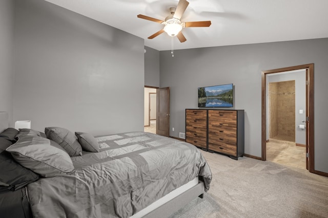 bedroom with a ceiling fan, lofted ceiling, light colored carpet, and baseboards