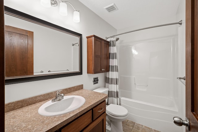 bathroom featuring toilet, vanity, visible vents, and shower / bathtub combination with curtain