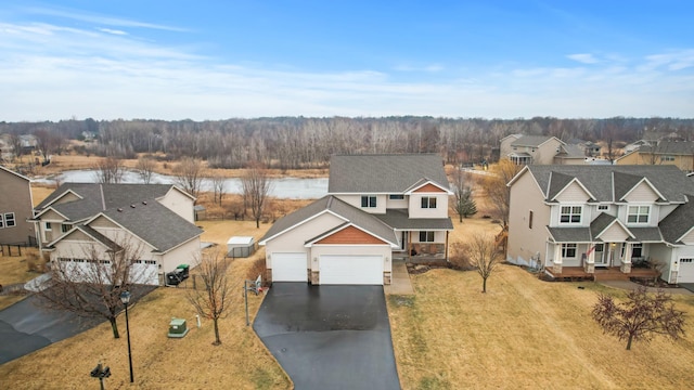 birds eye view of property with a residential view