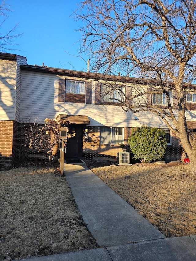 view of front of home with brick siding