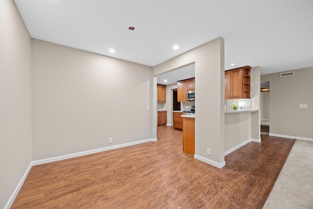 9700 Portland Ave S Unit 226, Bloomington, MN 55420 - unfurnished living room featuring recessed lighting, wood finished floors, and baseboards