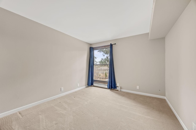 9700 Portland Ave S Unit 226, Bloomington, MN 55420 - spare room featuring a baseboard heating unit, baseboards, and light carpet