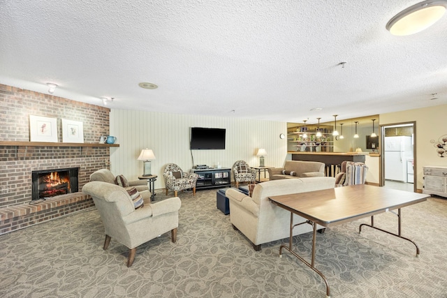 9700 Portland Ave S Unit 226, Bloomington, MN 55420 - carpeted living room featuring a textured ceiling and a fireplace