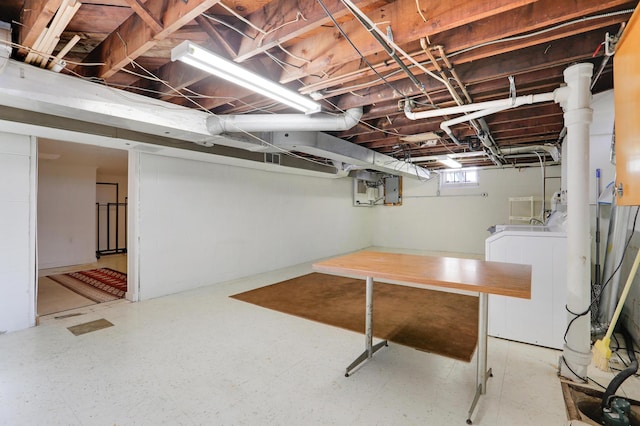 basement with separate washer and dryer and electric panel