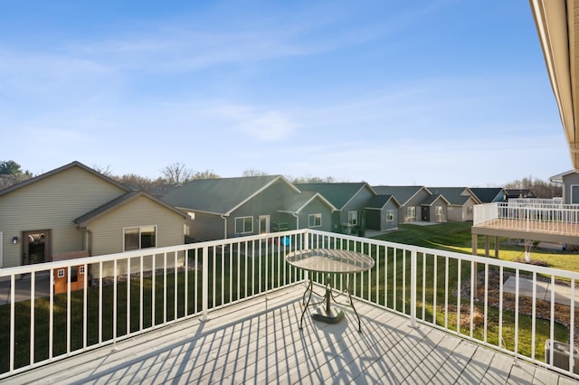 wooden terrace with a residential view