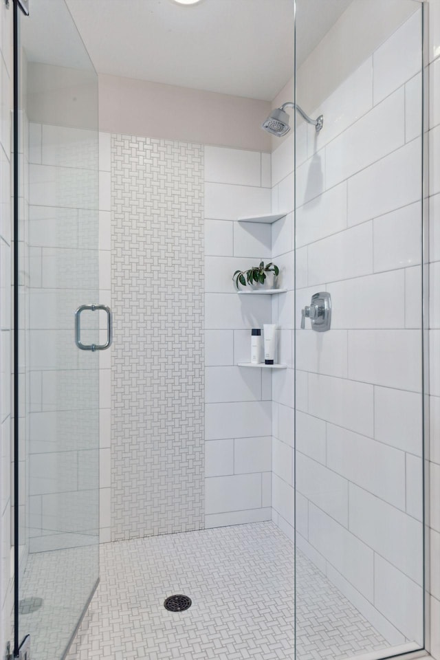 bathroom featuring an enclosed shower