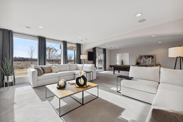 living room featuring light colored carpet and plenty of natural light