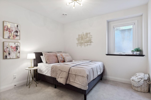 bedroom featuring light colored carpet