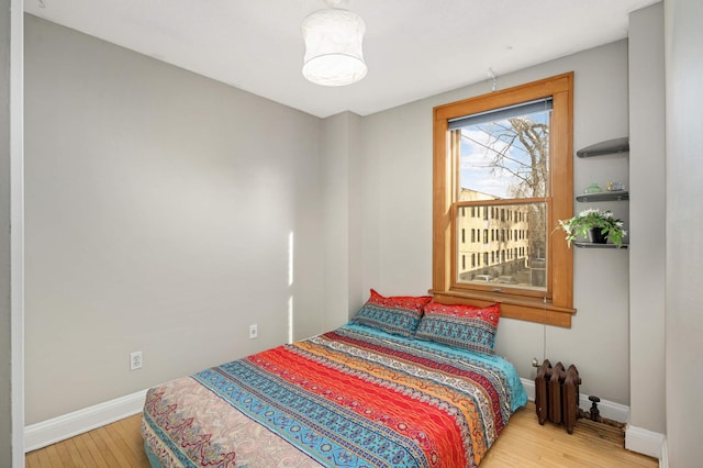 bedroom with wood-type flooring