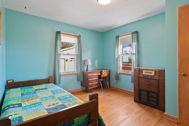 bedroom with light wood-type flooring