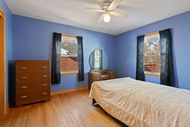 bedroom featuring ceiling fan and light hardwood / wood-style flooring