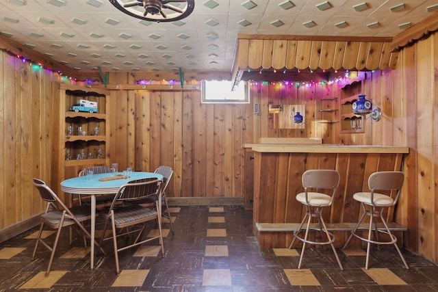 bar featuring wooden walls